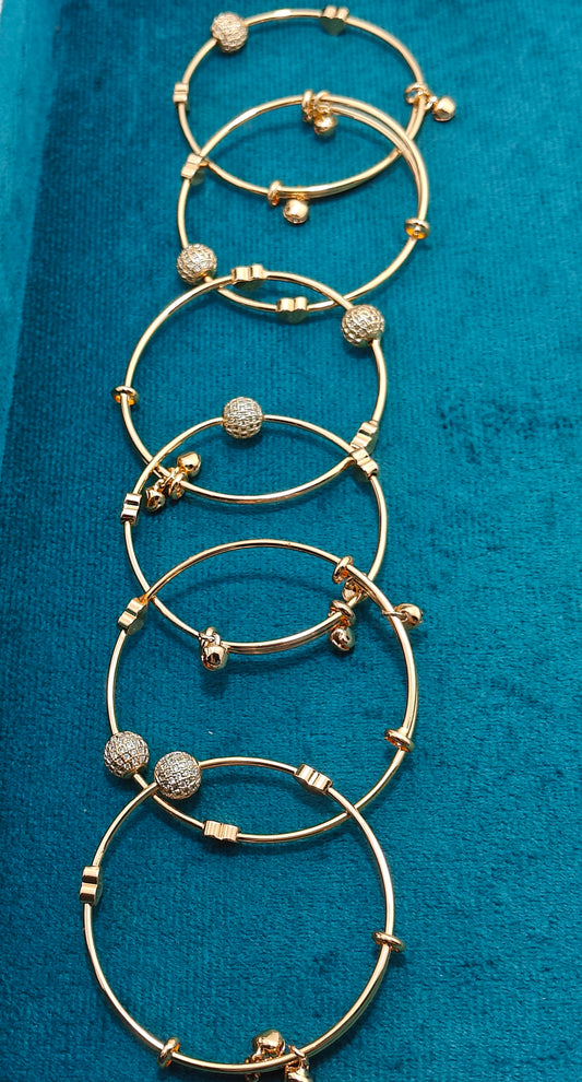 Girly Gold Toned Bracelet with Bells and Charms